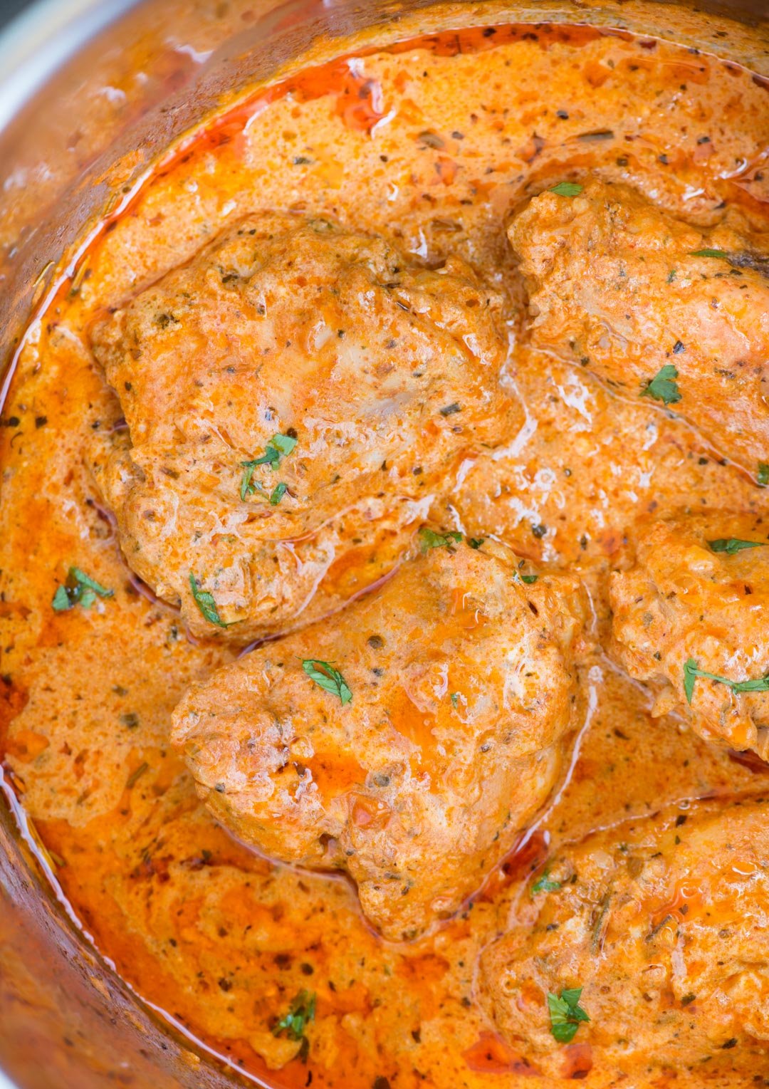 Instant Pot Chicken in a creamy tomato sauce with juicy chicken thighs, buttery tomato sauce is incredibly delicious and takes less than 30 minutes to make.