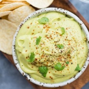 Creamy Avocado Dip made with Avocado, Sour cream, garlic, Lemon Juice is a perfect dip for Nachos, Pita and veggies. Make this for a quick snack or at your next party to impress your guests.
