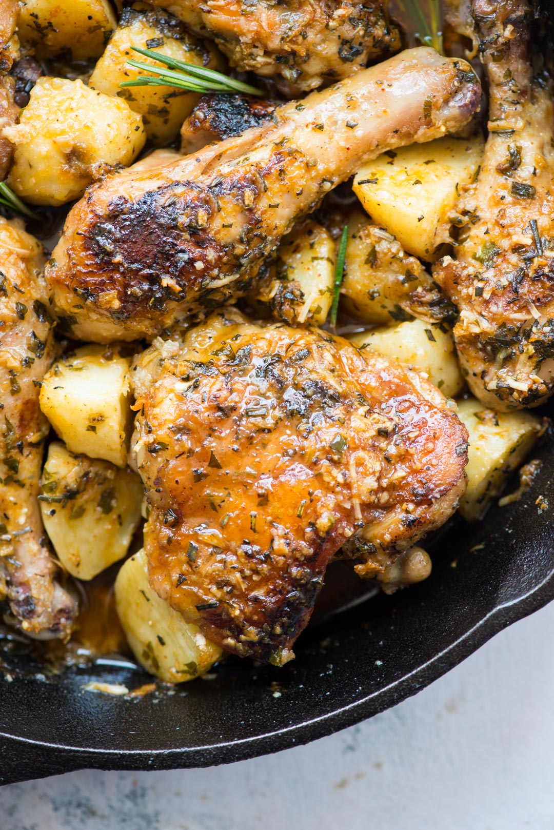 Baked chicken and potatoes in a butter garlic herb sauce, crispy garlic parmesan crusted chicken is a delicious one-pan dinner and very easy to prepare.