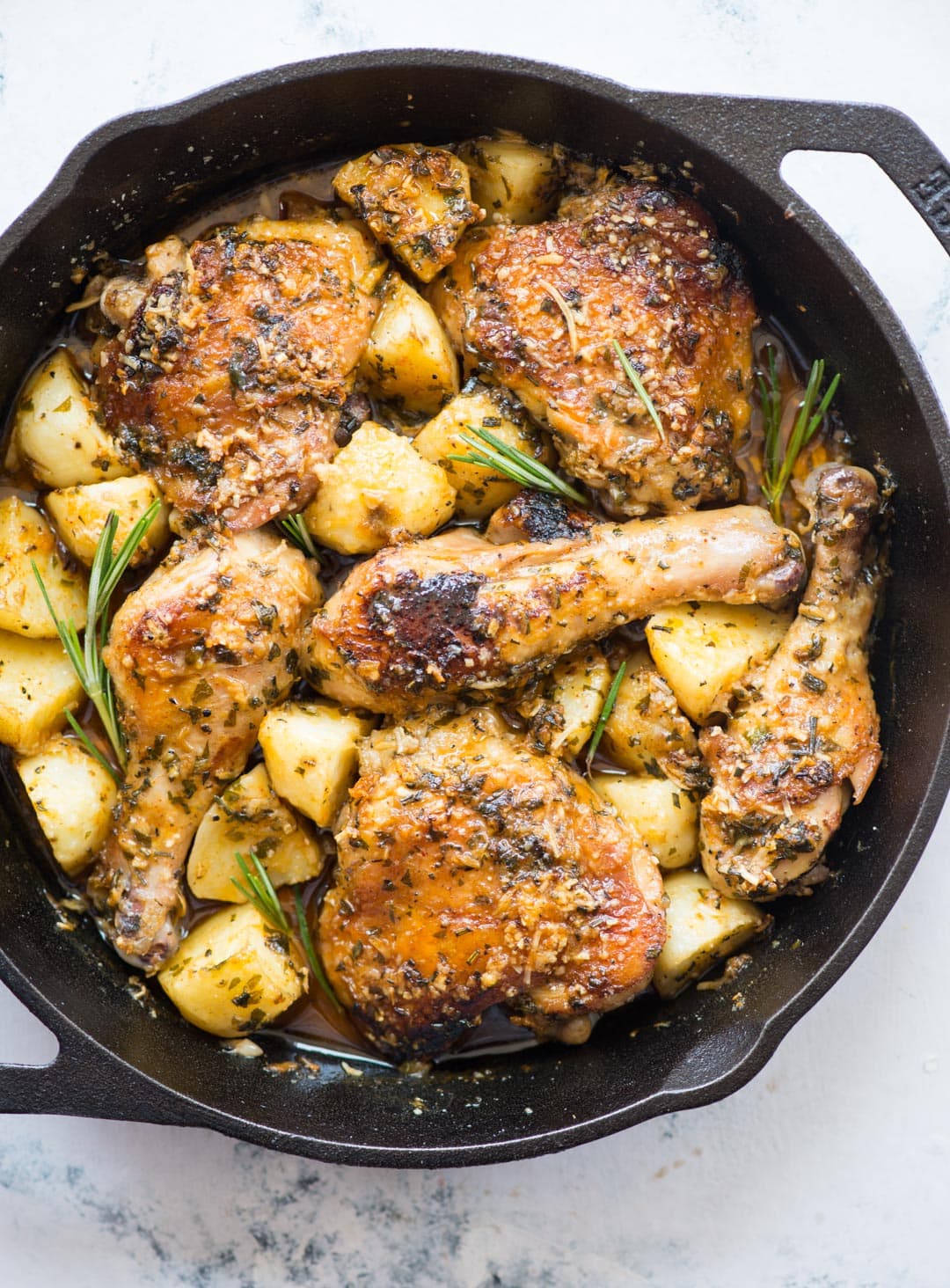 Baked chicken and potatoes in a butter garlic herb sauce, crispy garlic parmesan crusted chicken is a delicious one-pan dinner and very easy to prepare.