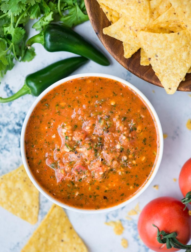 Top view of Tomato Salsa in a small bowl with chips