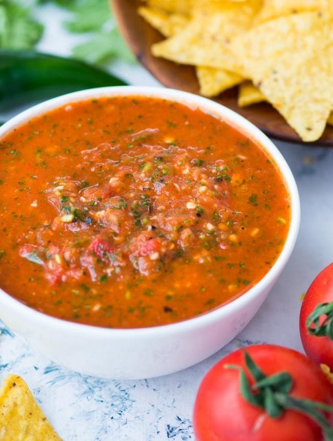 Fresh tomato salsa which has a depth of flavour from roasted tomatoes, jalapeno, fresh cilantro. It is spicy, tangy and perfect to dip your favourite tortilla chips into it.