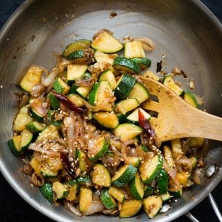 This flavour-packed Zucchini Stir Fry gets ready in 15 mins. Make this super quick stir fry with Onion, Garlic, Zucchini tossed in a simple sauce.