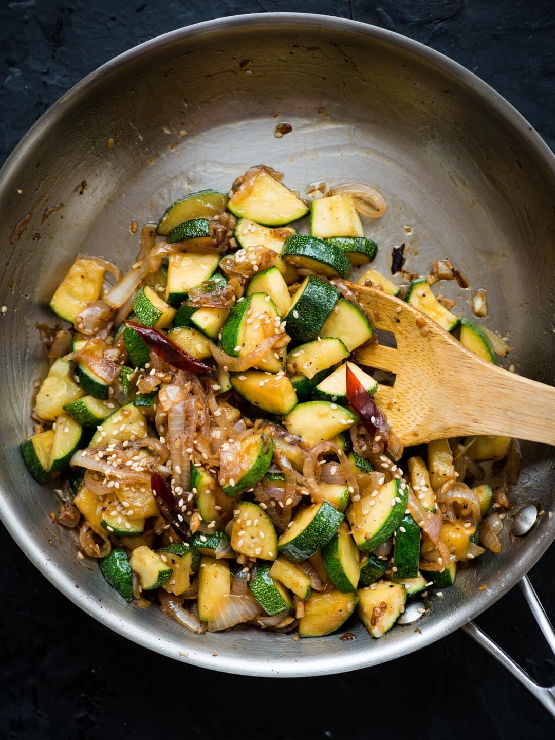 This flavour-packed Zucchini Stir Fry gets ready in 15 mins. Make this super quick stir fry with Onion, Garlic, Zucchini tossed in a simple sauce.