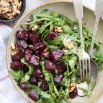 Arugula salad with roasted beetroots, fresh arugula leaves, goat cheese, walnut and a delicious balsamic dressing. It is easy to put together and is a perfect side dish to go with dinner.