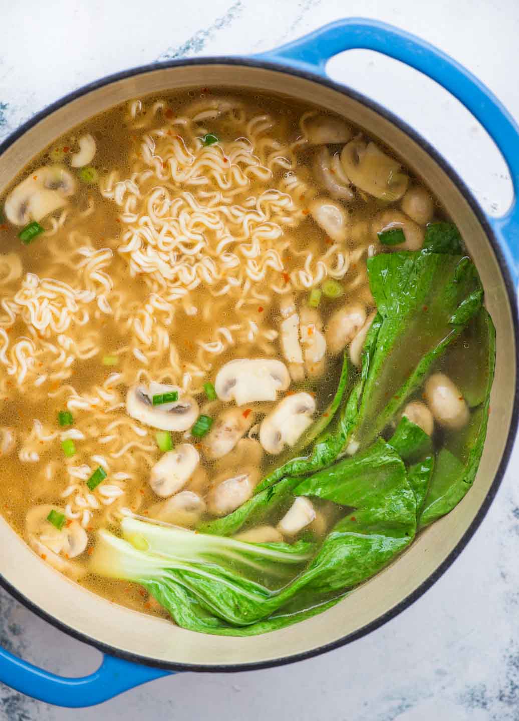 Spicy Pork Ramen takes less than 20 minutes to make. A really flavourful broth with a secret ingredient for extra depth of flavour, ramen noodles, spicy pork is comfort in a bowl, especially for cold winter days.