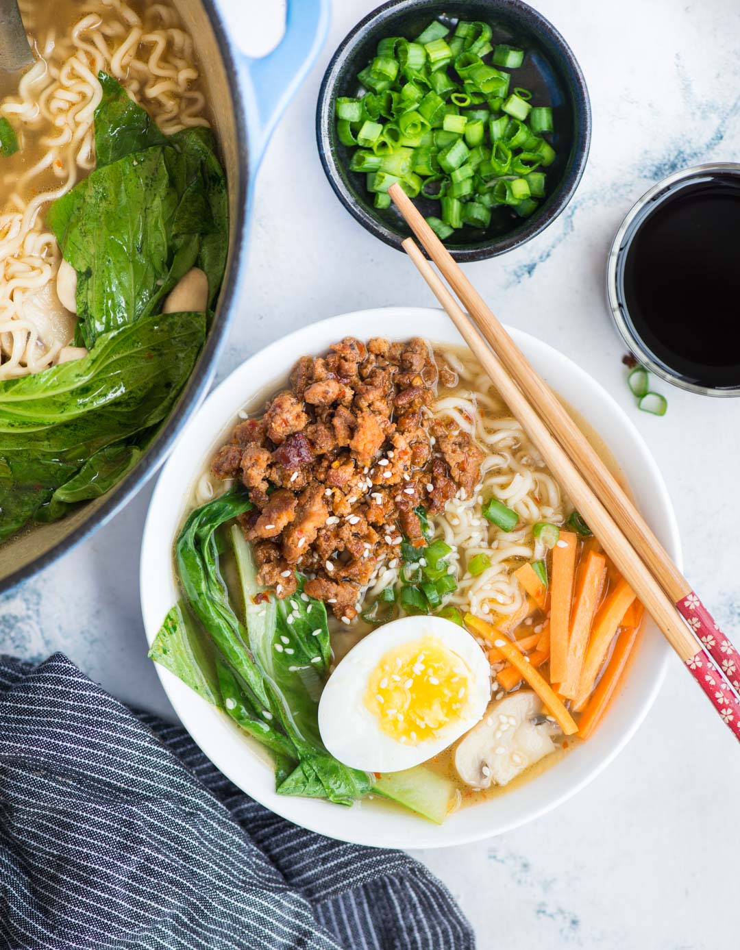 Spicy Pork Ramen takes less than 20 minutes to make. A really flavourful broth with a secret ingredient for extra depth of flavour, ramen noodles, spicy pork is comfort in a bowl, especially for cold winter days.