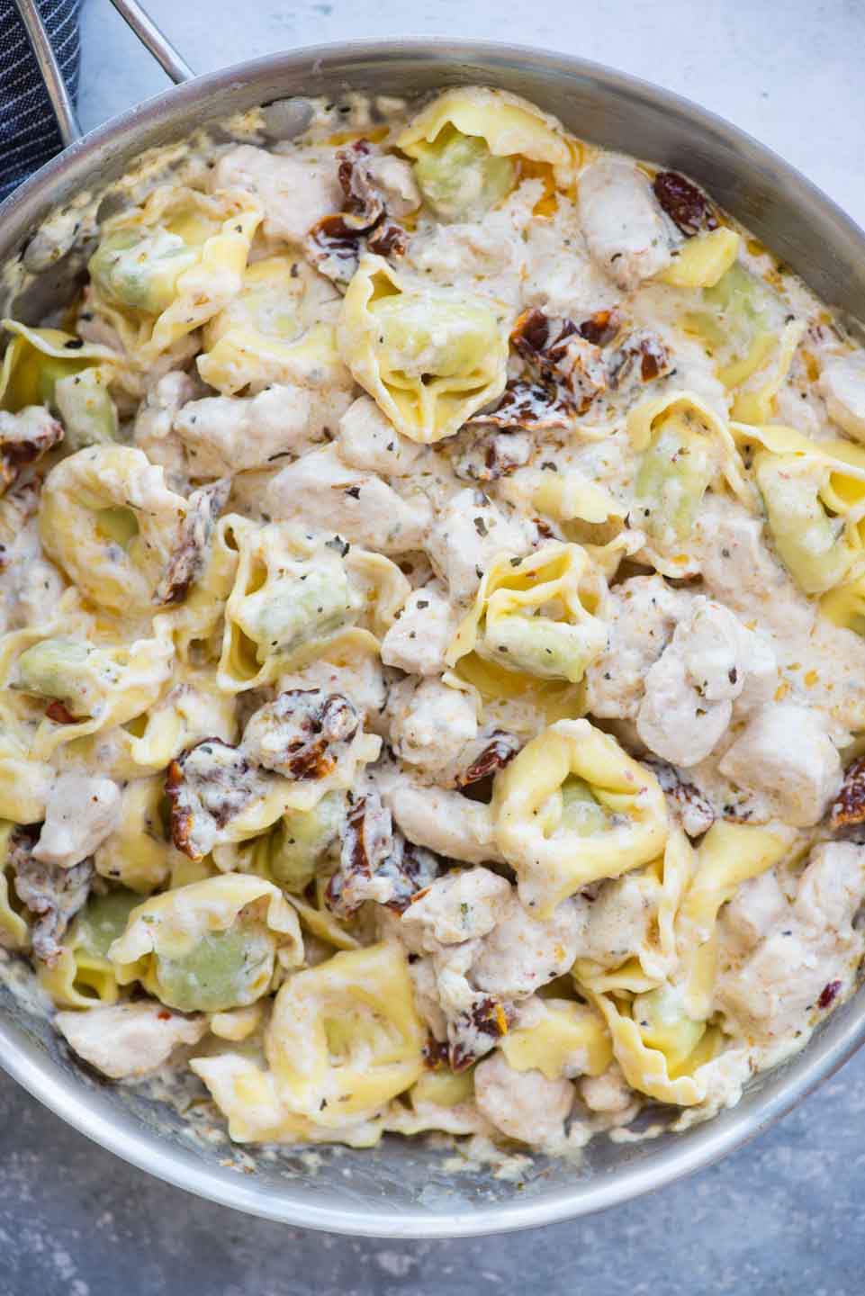 Creamy Chicken Tortellini with bacon and sundried tomato is comforting and easy dinner recipe- loaded with juicy chicken, bacon, sundried tomatoes and a delicious cream sauce. 