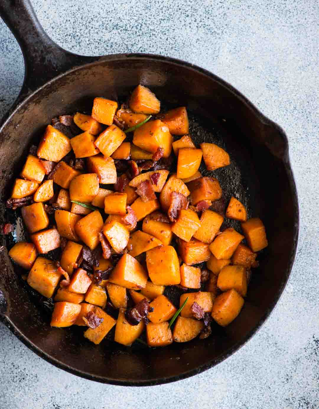 Maple Bacon Sweet Potato Hash with a hint of cinnamon and rosemary is easy to make. A perfect side dish to serve with your dinner or thanksgiving dinner. 