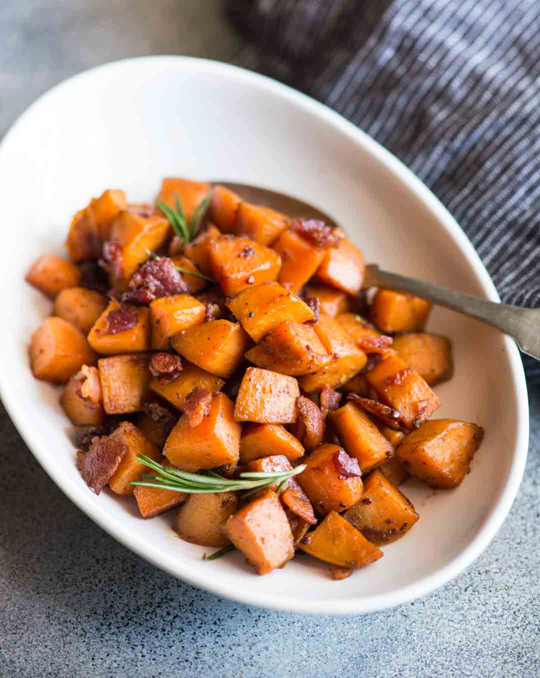 Maple Bacon Sweet Potato Hash with a hint of cinnamon and rosemary is easy to make. A perfect side dish to serve with your dinner or thanksgiving dinner. 