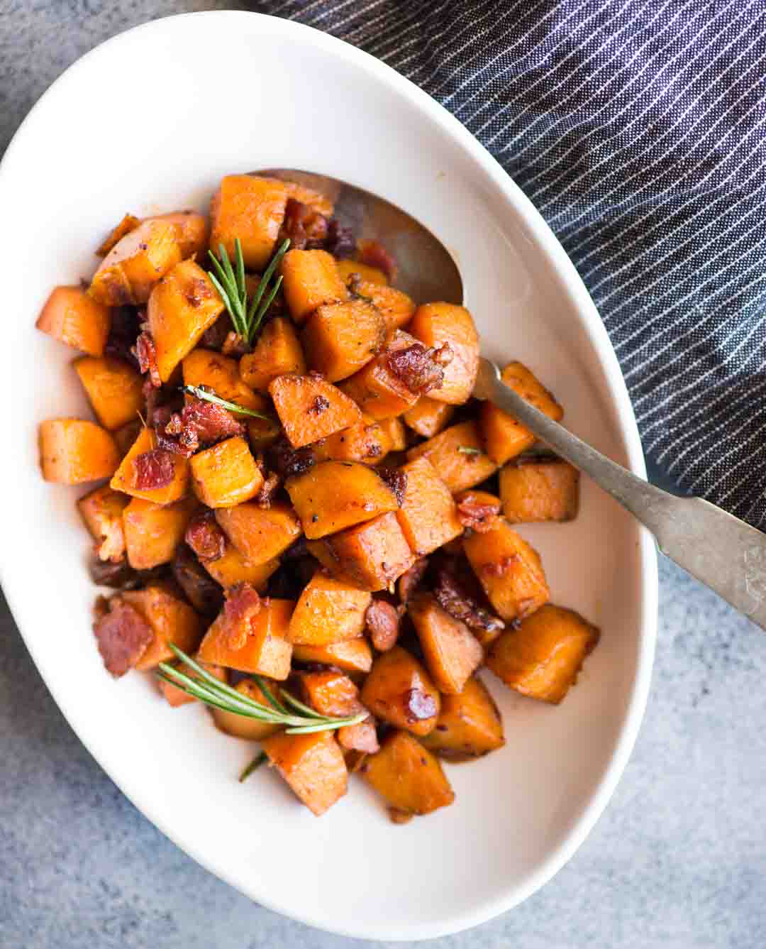 Maple Bacon Sweet Potato Hash with a hint of cinnamon and rosemary is easy to make. A perfect side dish to serve with your dinner or thanksgiving dinner.