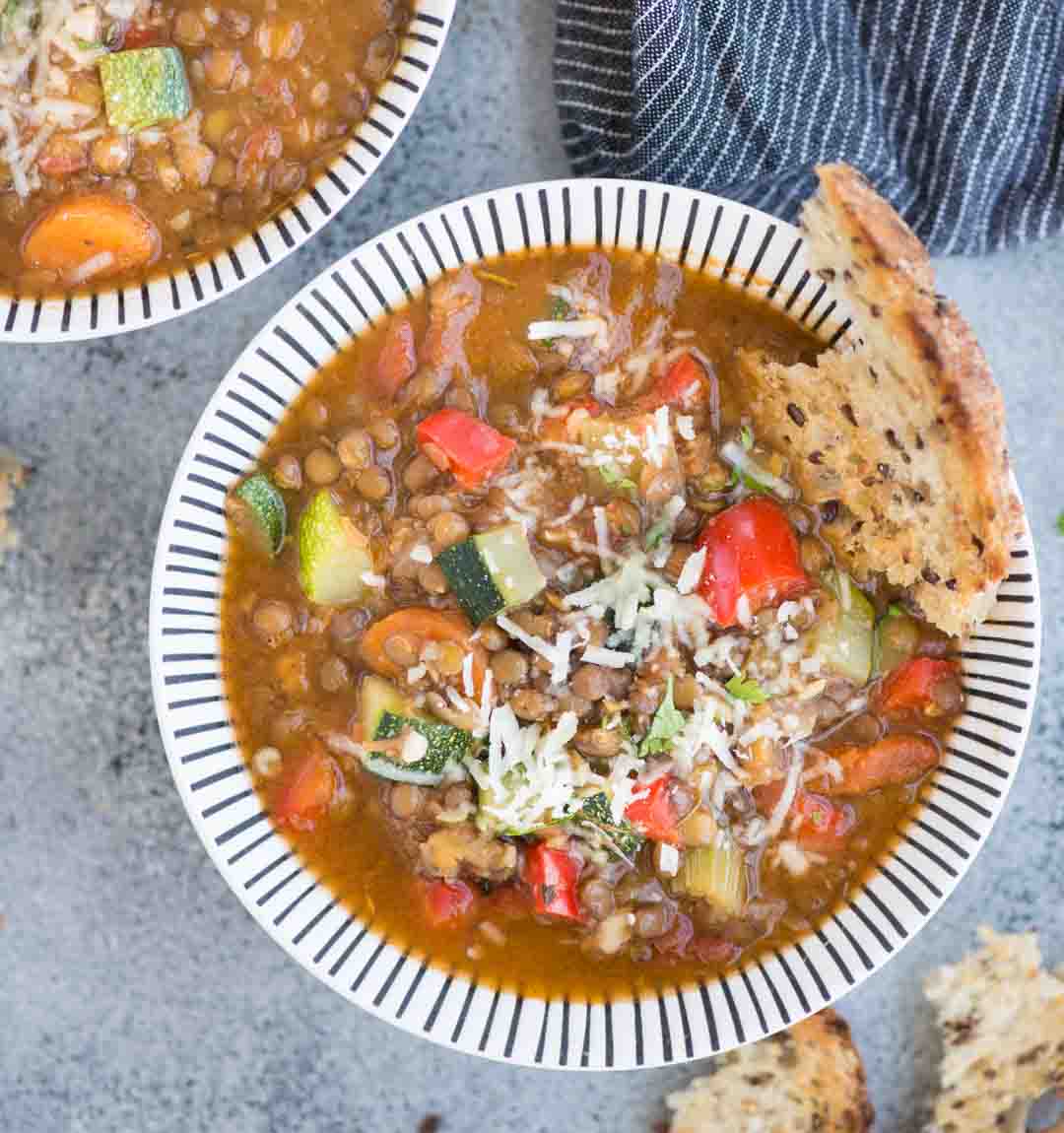 Vegetable Lentil Soup with array load of vegetables is a filling one-pot vegan meal. Made with Lentils, Zucchini, Carrot, Celery, this soup is loaded with plant-based protein and fiber.