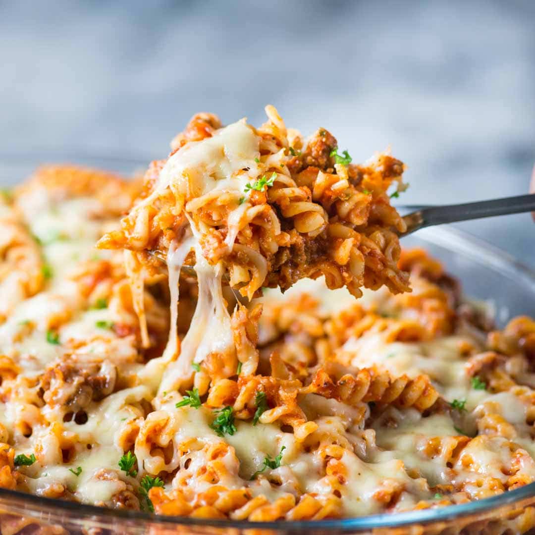 Our favourite Pasta Bake - tangy tomato sauce, spicy Italian Sausage and lots of cheese together makes this baked pasta dish delicious and super satisfying. 