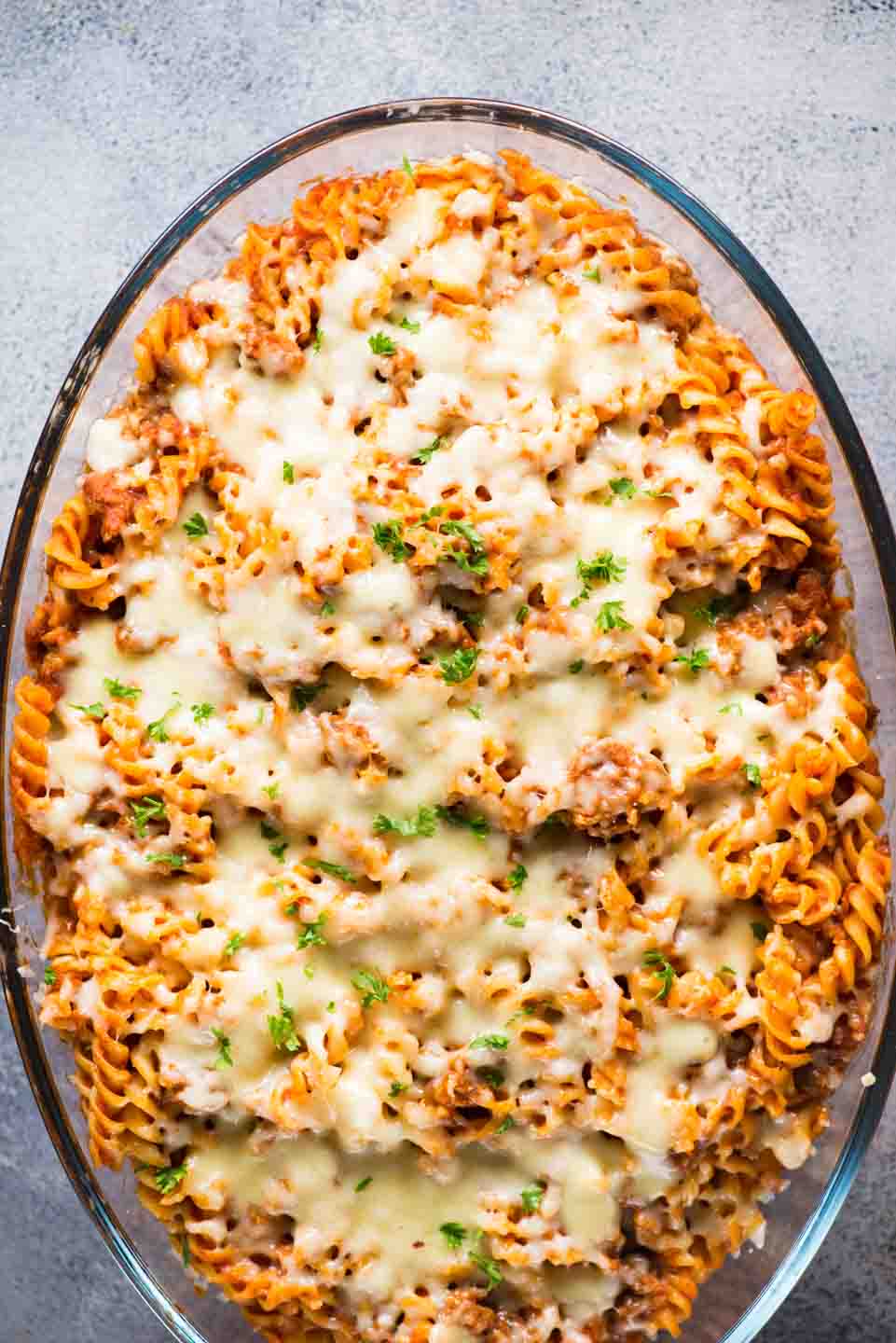 Our favourite Pasta Bake - tangy tomato sauce, spicy Italian Sausage and lots of cheese together makes this baked pasta dish delicious and super satisfying. 