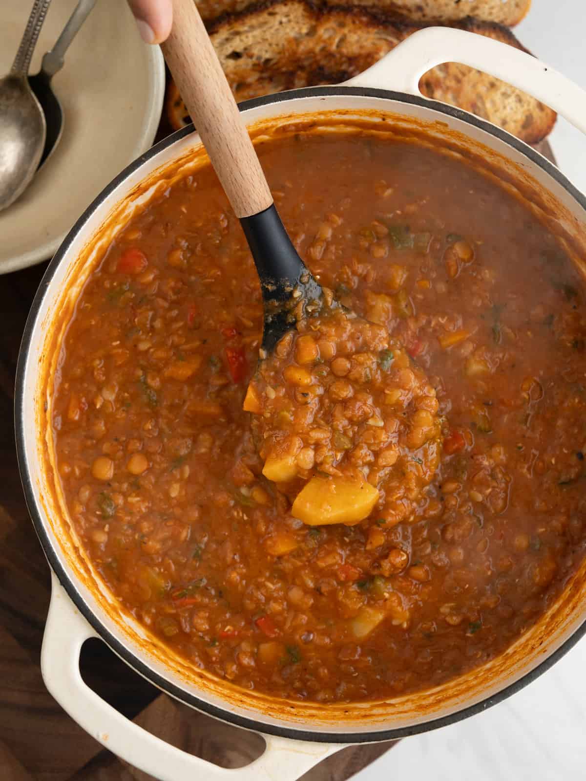 Pot of lentil soup with potato, zucchini, carrots and pepper. 
