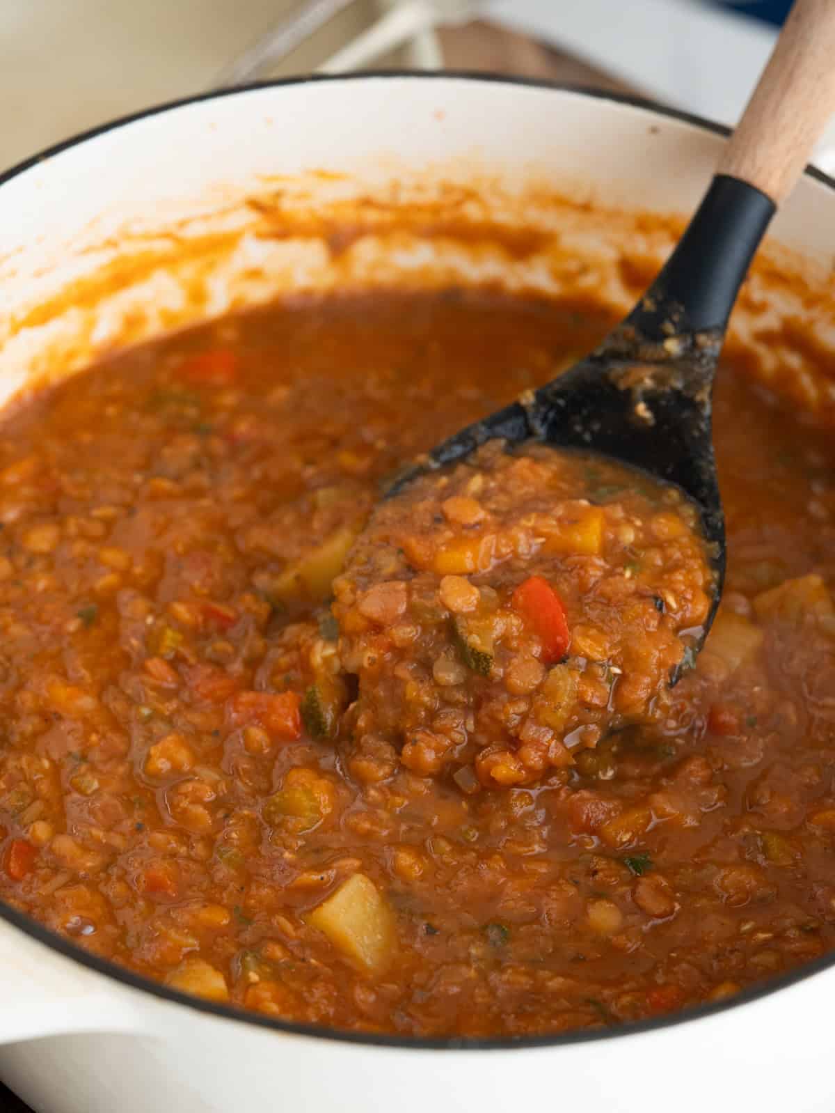 Pot of lentil soup with potato, zucchini, carrots and pepper. 