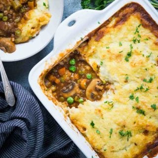 Warm and cosy Vegetarian Shepherd's Pie made from Lentils and vegetables, a flavourful wine-based gravy and then topped with a creamy layer of mashed potato.