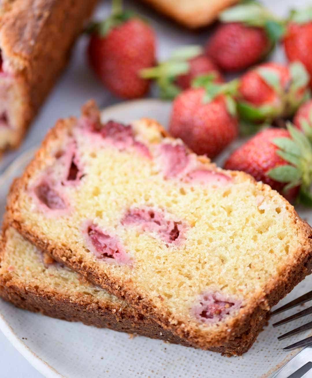 Strawberry Cake with loads of fresh strawberries is made from scratch with basic pantry staples. You will get to taste strawberry in every bite of this buttery, moist and delicious cake.