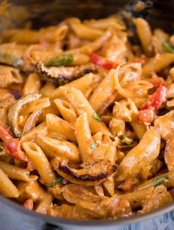 Chicken Fajita Pasta is a one-pot dinner that takes 30 minutes to make. Creamy pasta with chicken, peppers, onion and fajita seasoning, you would fall in love with this easy pasta recipe.