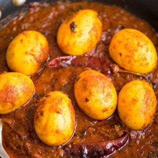 Egg Curry is a deliciously rich onion tomato gravy, tastes exactly like the ones you get in dhabas. These are perfect with some rice or paratha and fresh salad on the side.