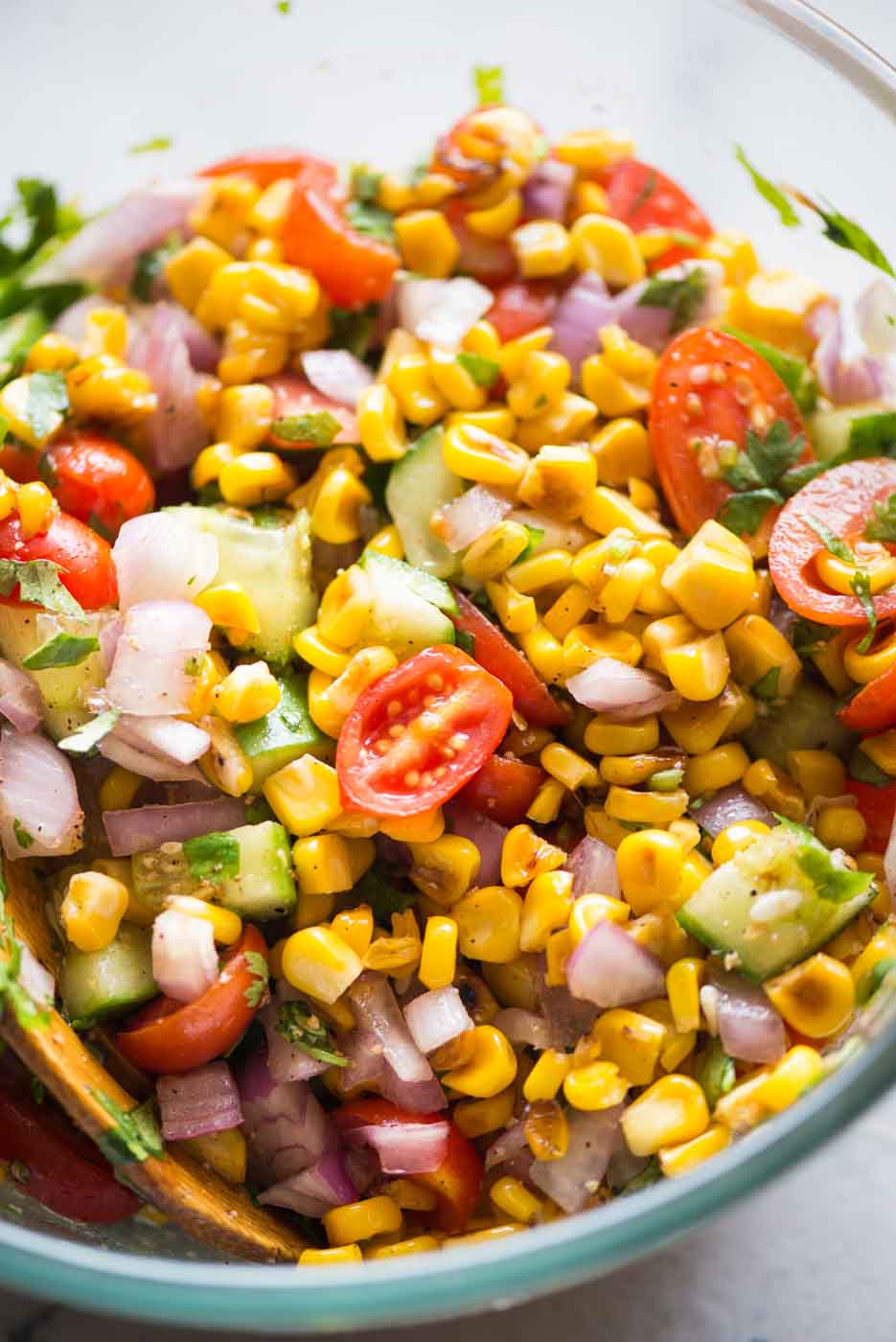 A bowl of served corn salad in a close up view