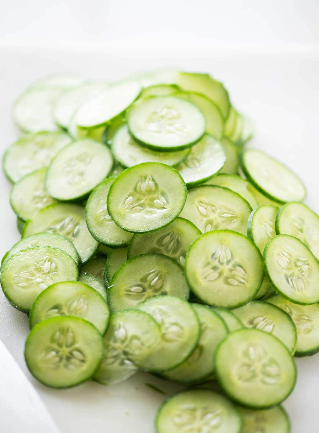 Fresh crunchy cucumbers sliced thinly to be used for salads.