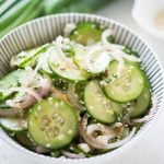 Asian Cucumber Salad with fresh crunchy Cucumber, Onion and an Asian dressing is a great side dish for any meal. It is very easy and quick to make.