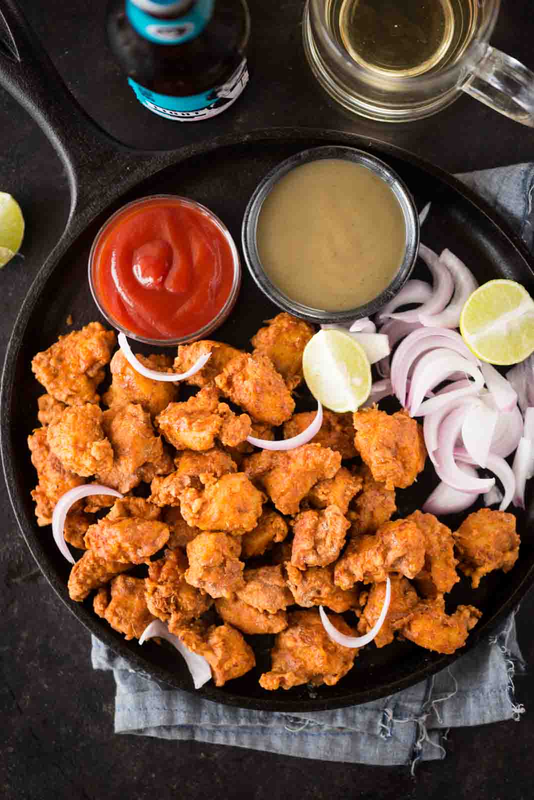 Seriously addictive Chicken pakora is a crowd pleasure in any party. Chicken coated in a thick spicy batter, fried until crispy and tastes exactly like street style. 