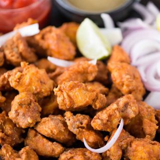 Seriously addictive Chicken pakora is a crowd pleasure in any party. Chicken coated in a thick spicy batter, fried until crispy and tastes exactly like street style. 