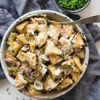 Roasted Potato Salad has Crunchy Roasted Potatoes, crispy Bacon, Onion, herb and a light creamy dressing. One of the best side dish to serve summer potluck or BBQ parties.