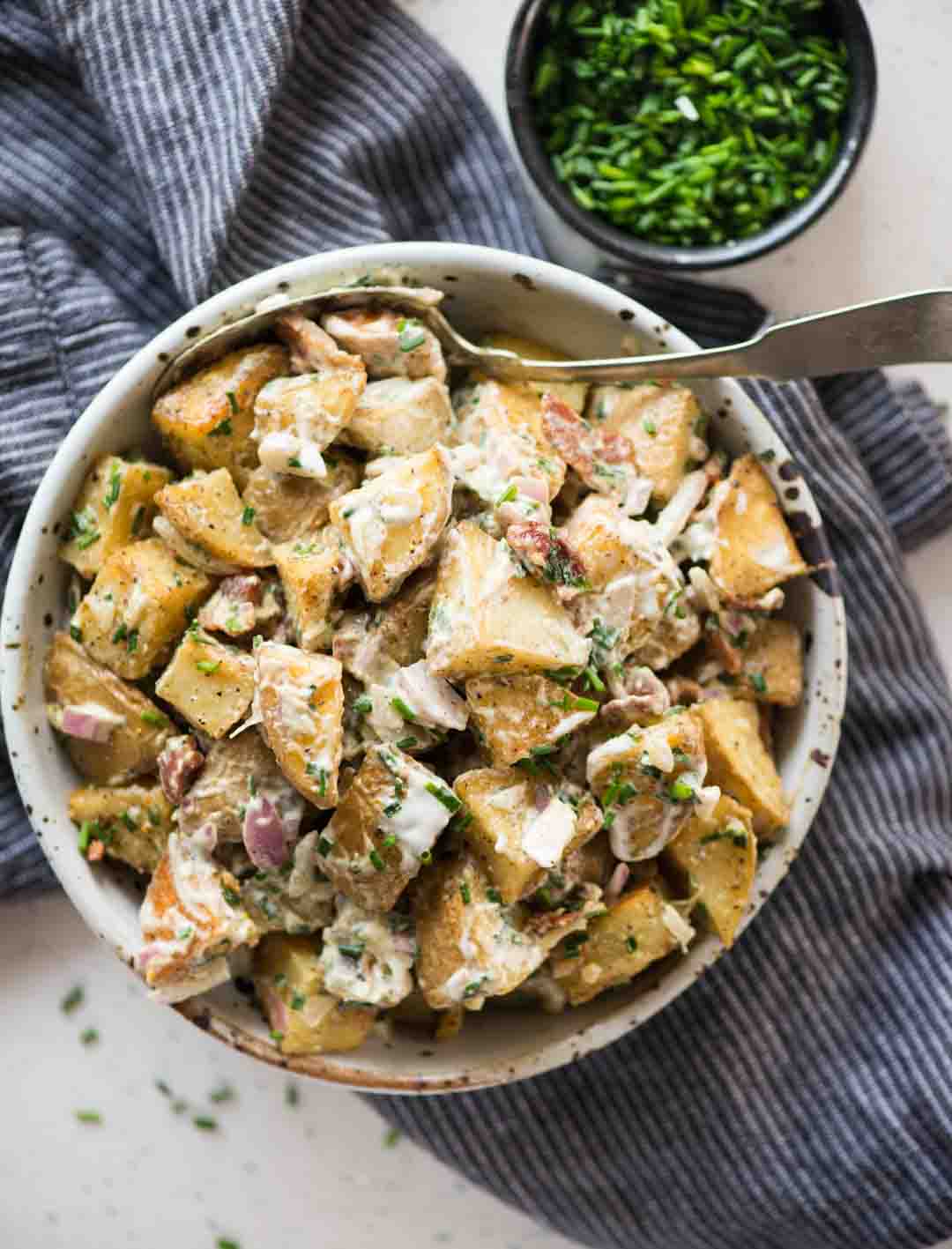 Roasted Potato Salad has Crunchy Roasted Potatoes, crispy Bacon, Onion, herb and a light creamy dressing. One of the best side dish to serve summer potluck or BBQ parties.