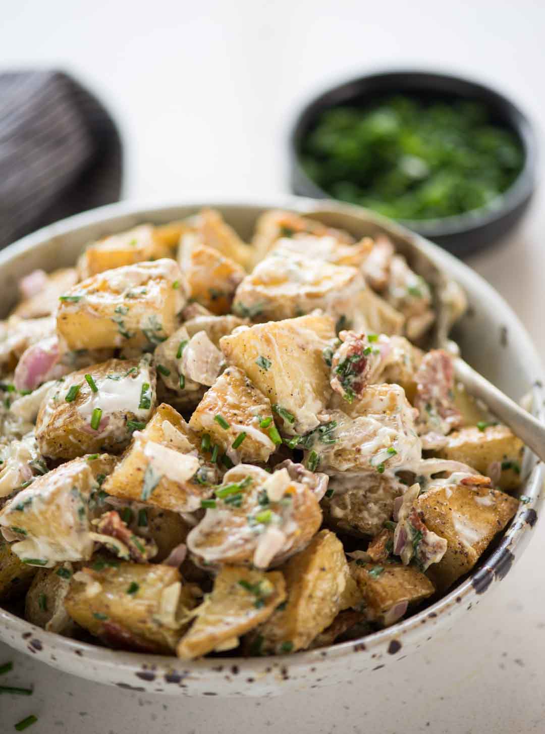 Roasted Potato Salad has Crunchy Roasted Potatoes, crispy Bacon, Onion, herb and a light creamy dressing. One of the best side dish to serve summer potluck or BBQ parties.