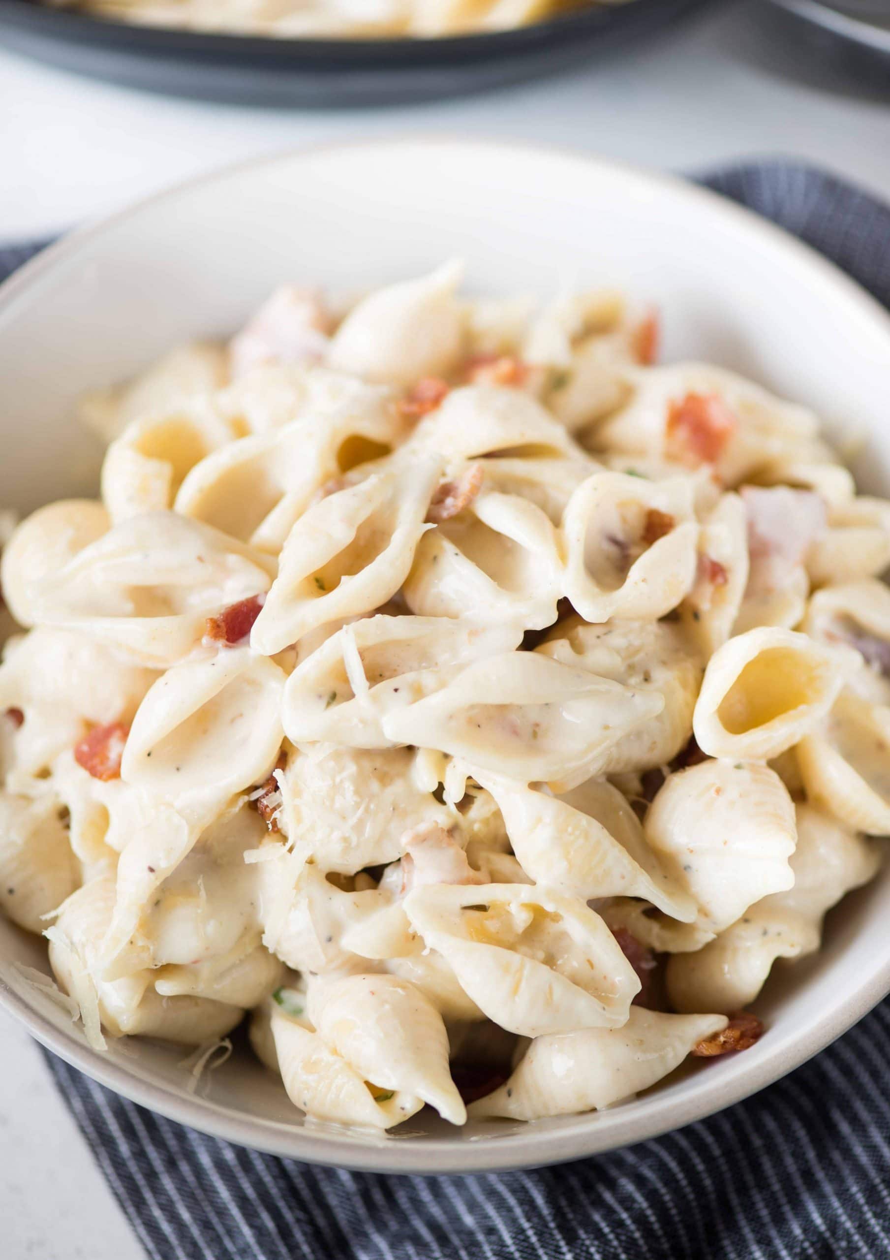 Serve this easy shell Pasta with more bacon and parmesan on top. 