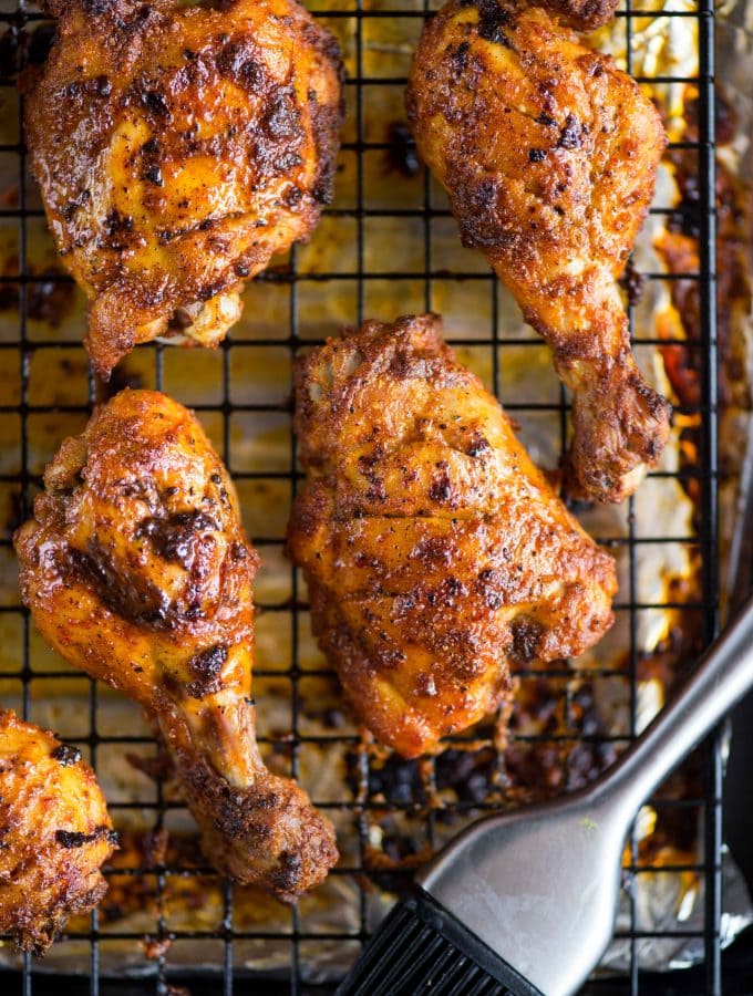 Smoky and juicy Tandoori Chicken gets its flavour from the Yogurt, ginger garlic paste and spice marination. It can be made on the grill, oven or Stovetop.