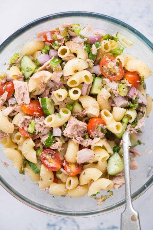 An easy 15 minutes Tuna Pasta salad recipe that is light and healthy with the goodness of tuna, macaroni, veggies, and olive oil. Perfect cold salad to serve during summer.