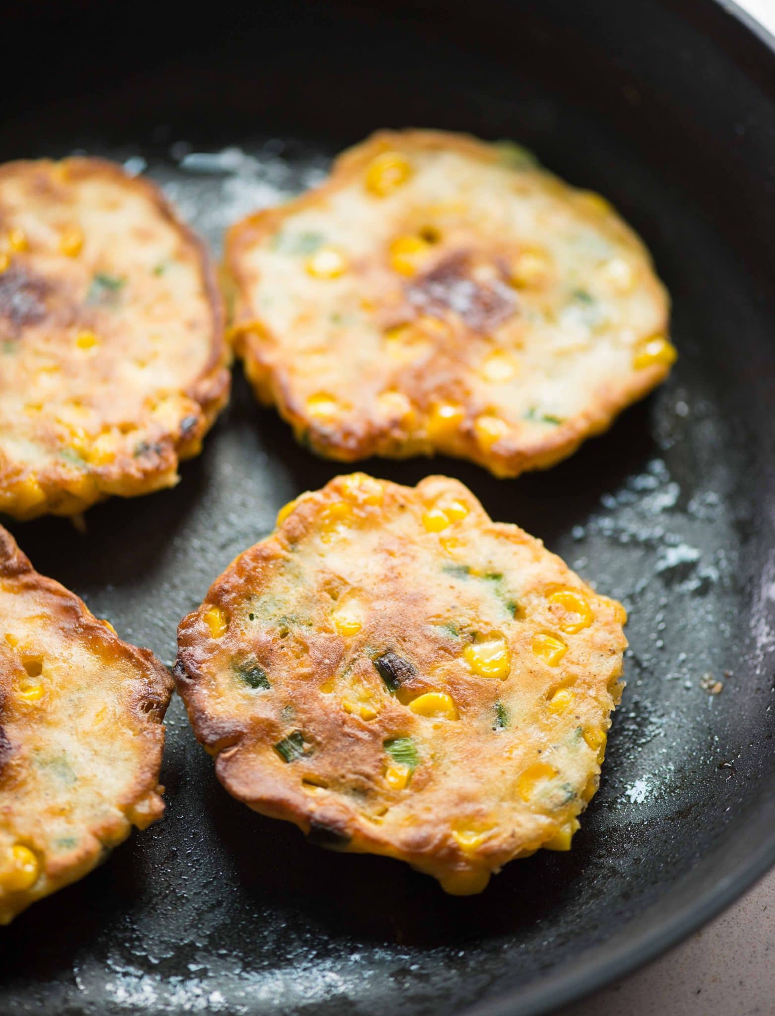 Crispy and Cheesy Corn Fritters - The flavours of kitchen
