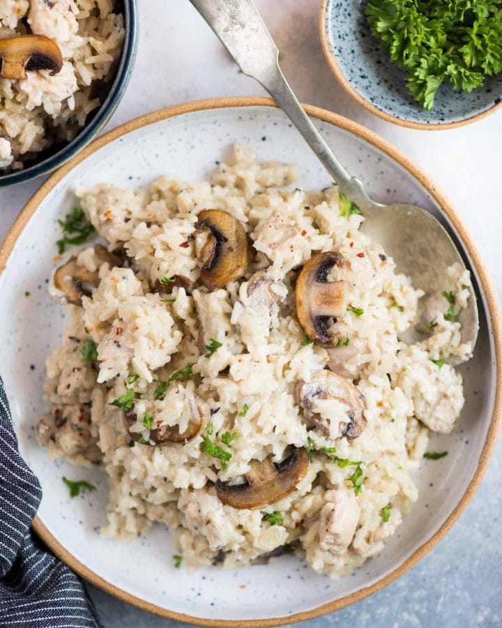 Creamy Chicken and rice with roasted mushrooms is a one-pot dinner that is hearty and comforting. Caramelized mushroom adds so much flavour to the dish and makes a perfect family-friendly dinner.