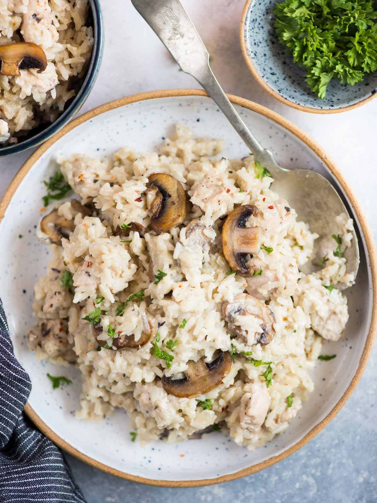 Creamy Chicken and rice with roasted mushrooms is a one-pot dinner that is hearty and comforting. Caramelized mushroom adds so much flavour to the dish and makes a perfect family-friendly dinner. 