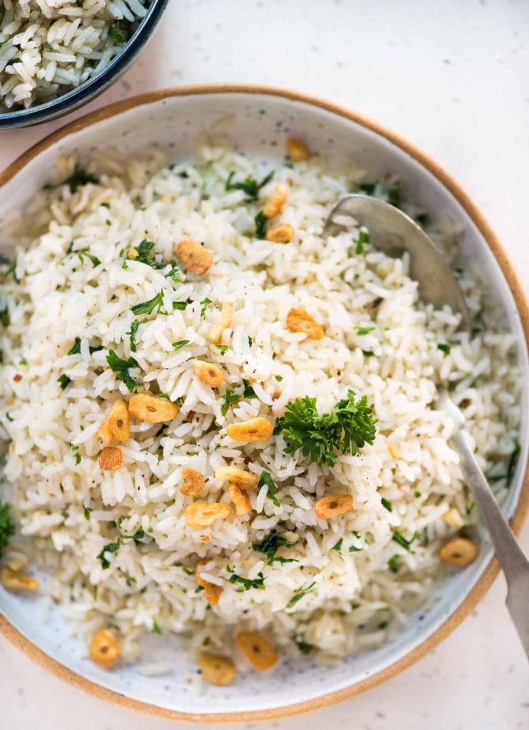 Garlic butter rice with a subtle flavor from parsley, this is a perfect side dish to serve. The rice is perfectly seasoned and smells heavenly of garlic butter.