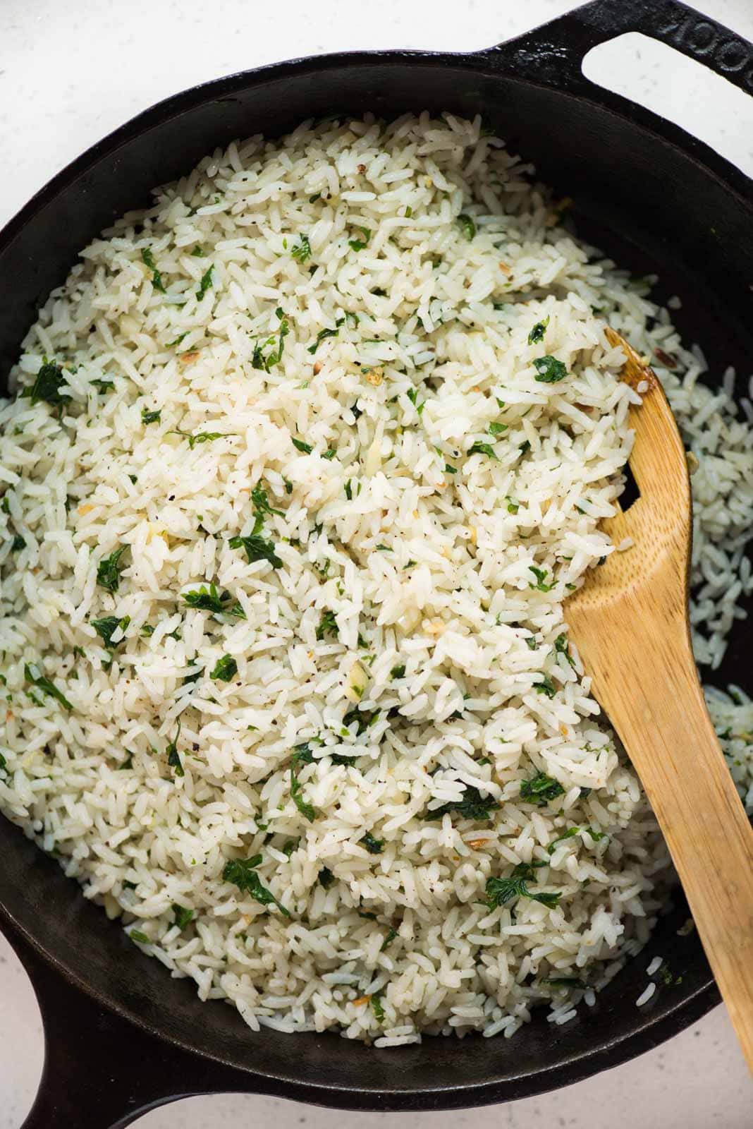Garlic butter rice with a subtle flavor from parsley, this is a perfect side dish to serve. The rice is perfectly seasoned and smells heavenly of garlic butter. 