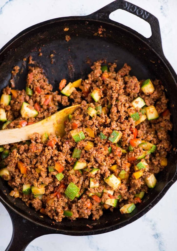 A healthy dish with ground beef and veggies stir friedd in a skillet.