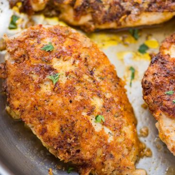 Perfectly crispy Parmesan Crusted Chicken recipe is an easy low carb chicken dinner made in just 15 minutes. Chicken coated with mayo for extra moist chicken, breaded with parmesan, and pan-fried.