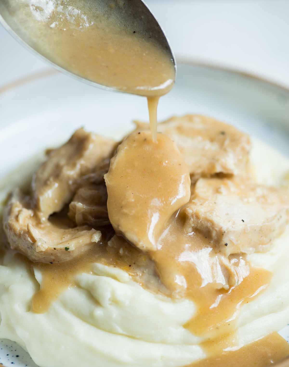 Chicken and gravy made in the Instant pot have tender chicken breast and creamy thick gravy made from scratch. Made totally from scratch without any gravy mix or canned soup mix. 