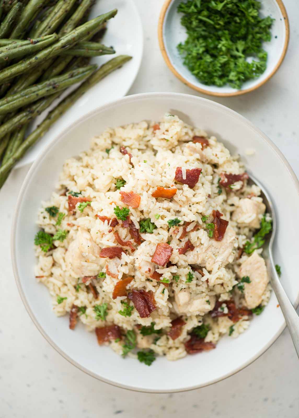 Instant Pot Ranch chicken and rice with crispy bacon is a one-pot dinner.  Juicy chicken breast and rice, perfectly seasoned with ranch seasoning. 