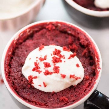 This Red Velvet Mug Cake is airy, ultra moist, and tastes just like the regular oven-baked red velvet cake. Topped with cream cheese frosting, this eggless microwave mug cake is ready in less than 10 minutes.