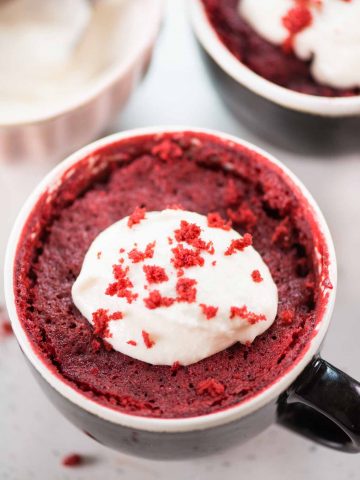 This Red Velvet Mug Cake is airy, ultra moist, and tastes just like the regular oven-baked red velvet cake. Topped with cream cheese frosting, this eggless microwave mug cake is ready in less than 10 minutes.