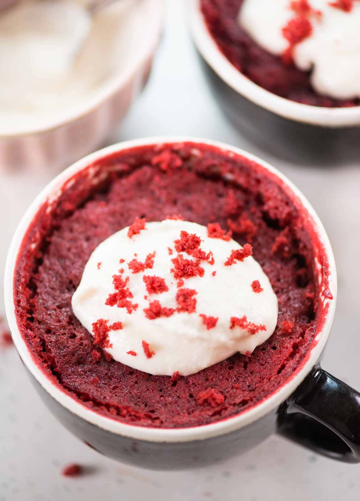 This Red Velvet Mug Cake is airy, ultra moist, and tastes just like the regular oven-baked red velvet cake. Topped with cream cheese frosting, this eggless microwave mug cake is ready in less than 10 minutes.