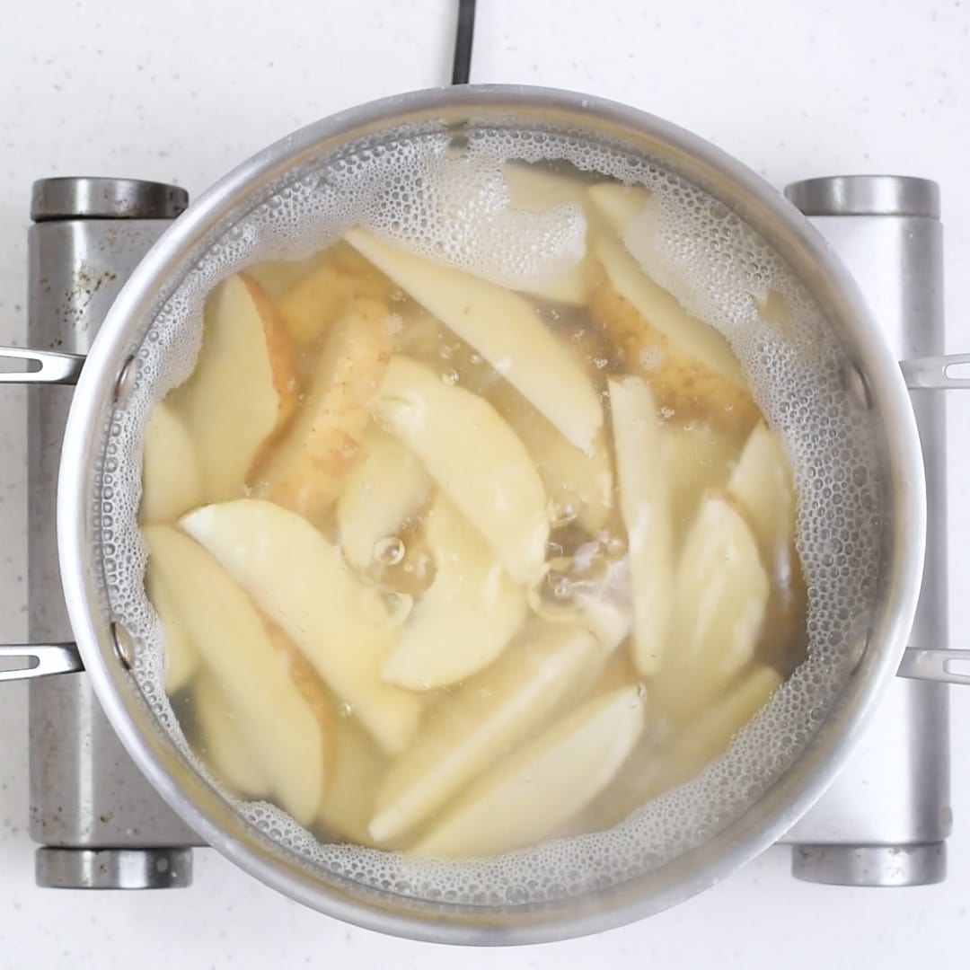 Cooking potatoes for Baked Greek Potato Wedges. 