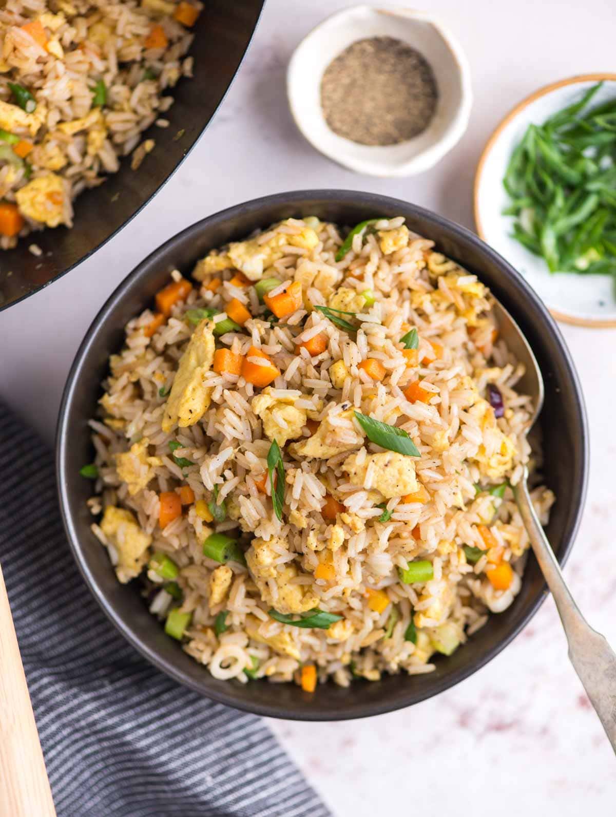 Egg fried rice - Nice fluffy rice, scrambled egg, crunchy vegetables, this restaurant-style fried rice is so easy and can be made in less than 20 minutes.