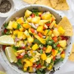 Cover pic showing pineapple mango salsa in a bowl alongside chips